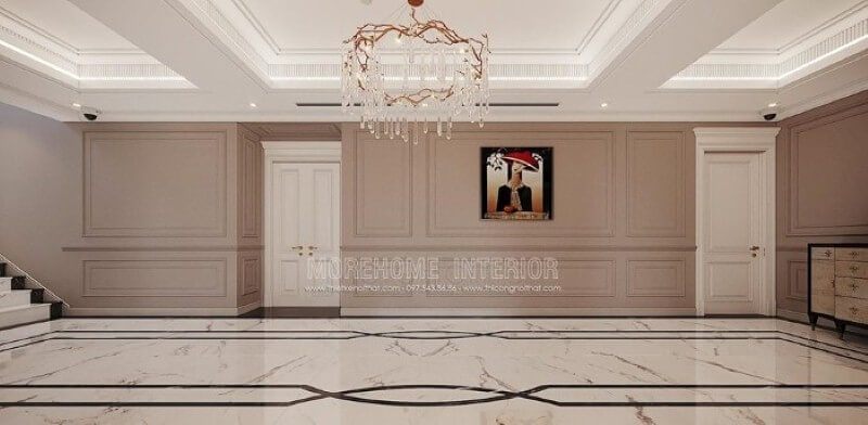 Trang trí hành lang đẹp ấn tượng với họa tiết độc đáo từ sàn lát đá cùng đường chỉ tường ấn tượng, bức tranh điểm nhấn kết hợp với nét tinh tế từ đèn trần cao cấp.