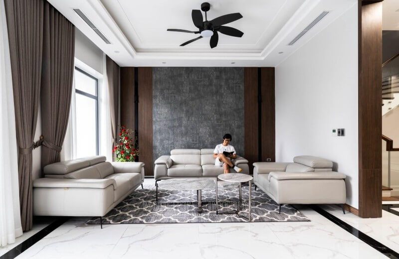 Công trình thi công nội thất phòng khách biệt thự hiện đại với đồ nội thất sofa bọc da sang trọng tại Nghệ An